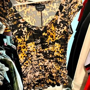 Bebe cap sleeve peplum leopard top